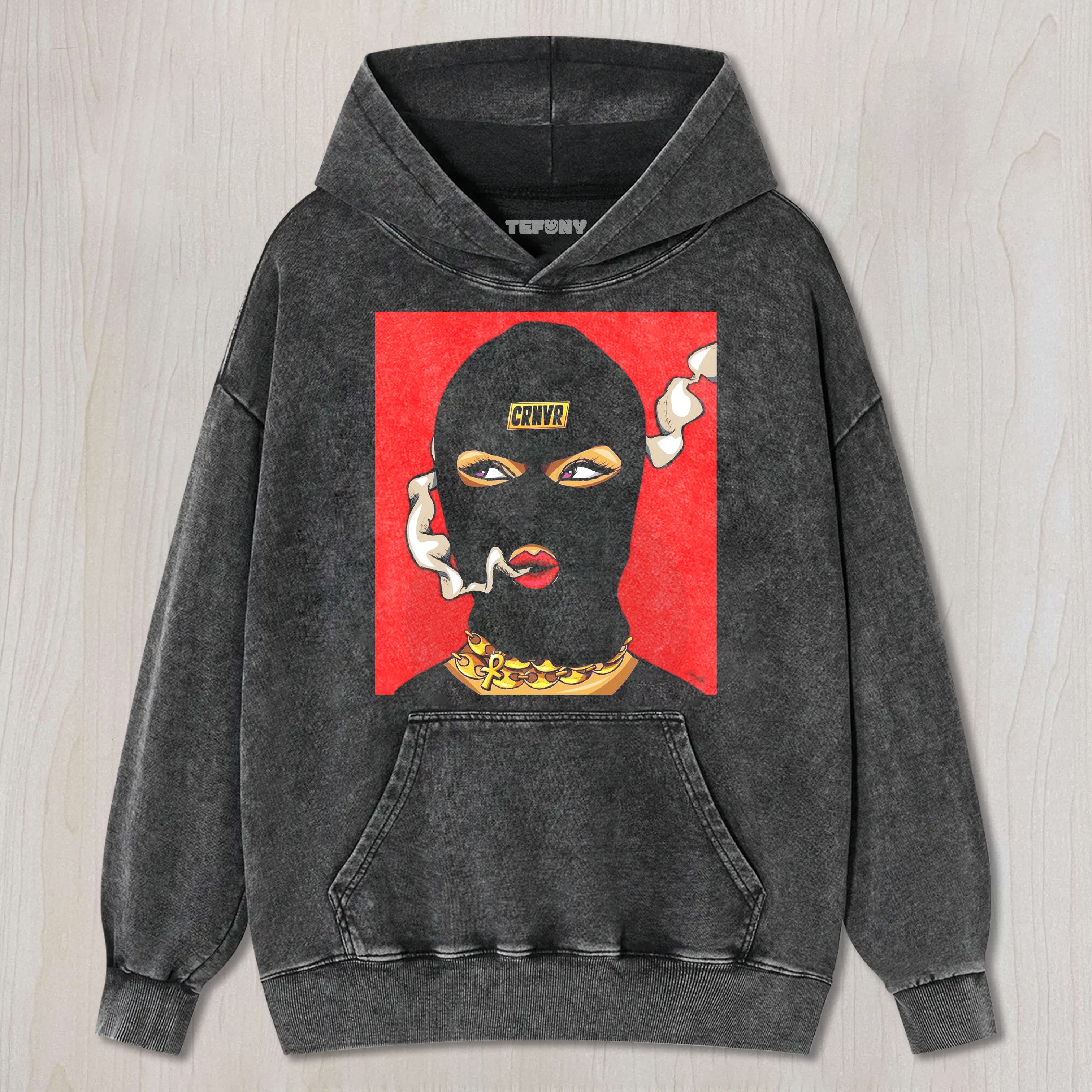 A PERSON SMOKING WHILE WEARING A HAT T-SHIRT & LONG SLEEVES & HOODIES