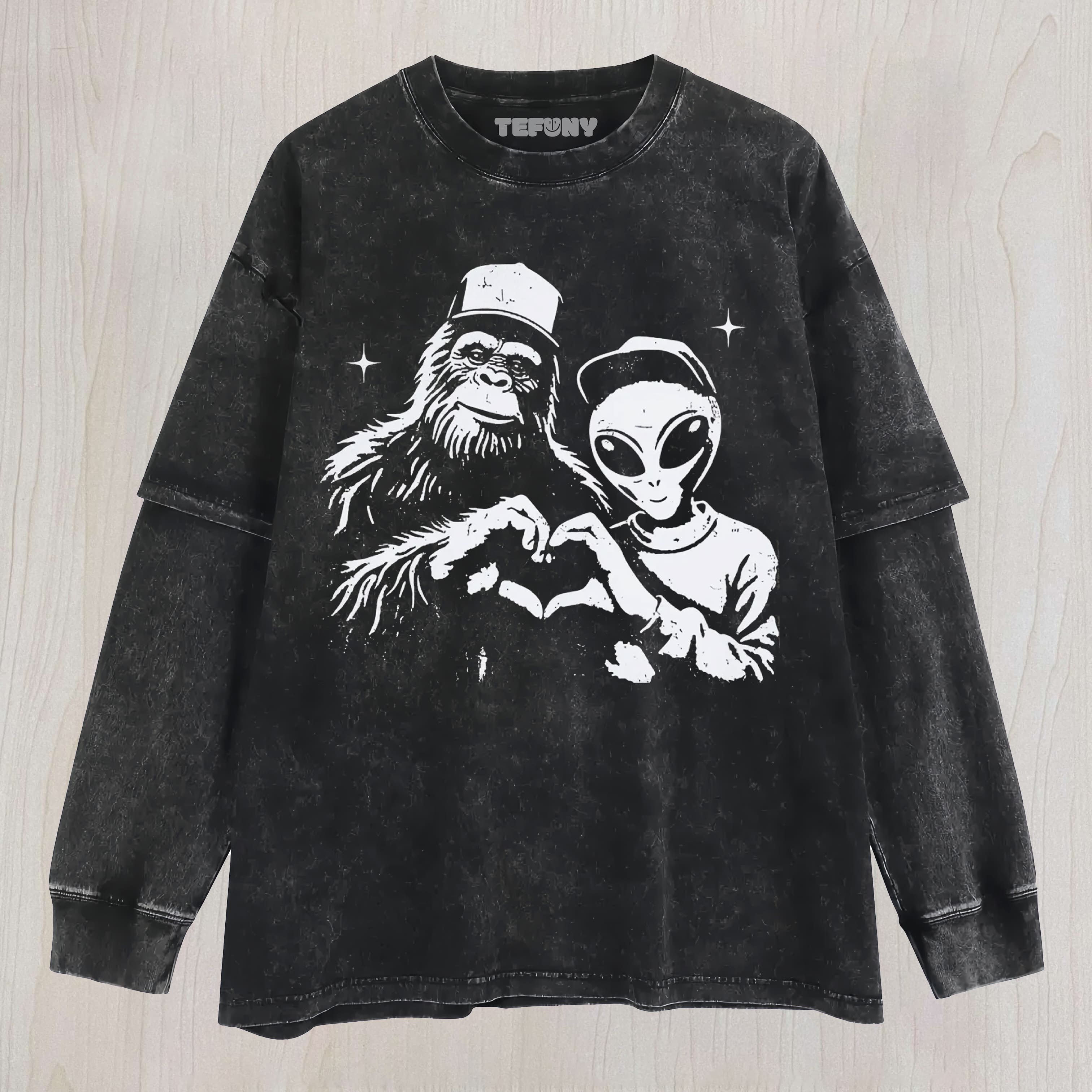 BIGFOOT AND ALIEN MAKING HEART GRAPHIC VINTAGE WASHED UNISEX TEE, TANK TOP, LAYERED LS, SWEATSHIRT & HOODIE