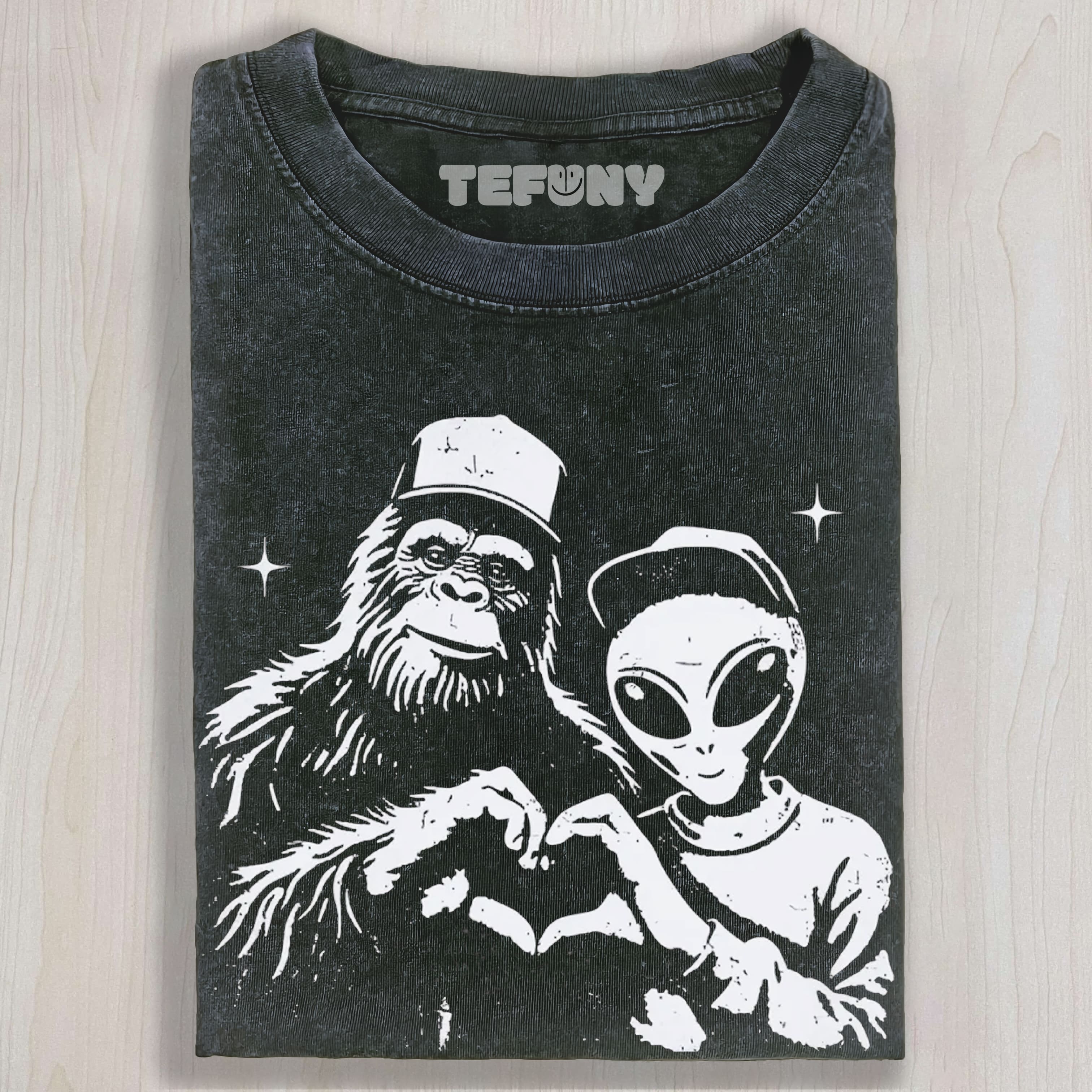 BIGFOOT AND ALIEN MAKING HEART GRAPHIC VINTAGE WASHED UNISEX TEE, TANK TOP, LAYERED LS, SWEATSHIRT & HOODIE