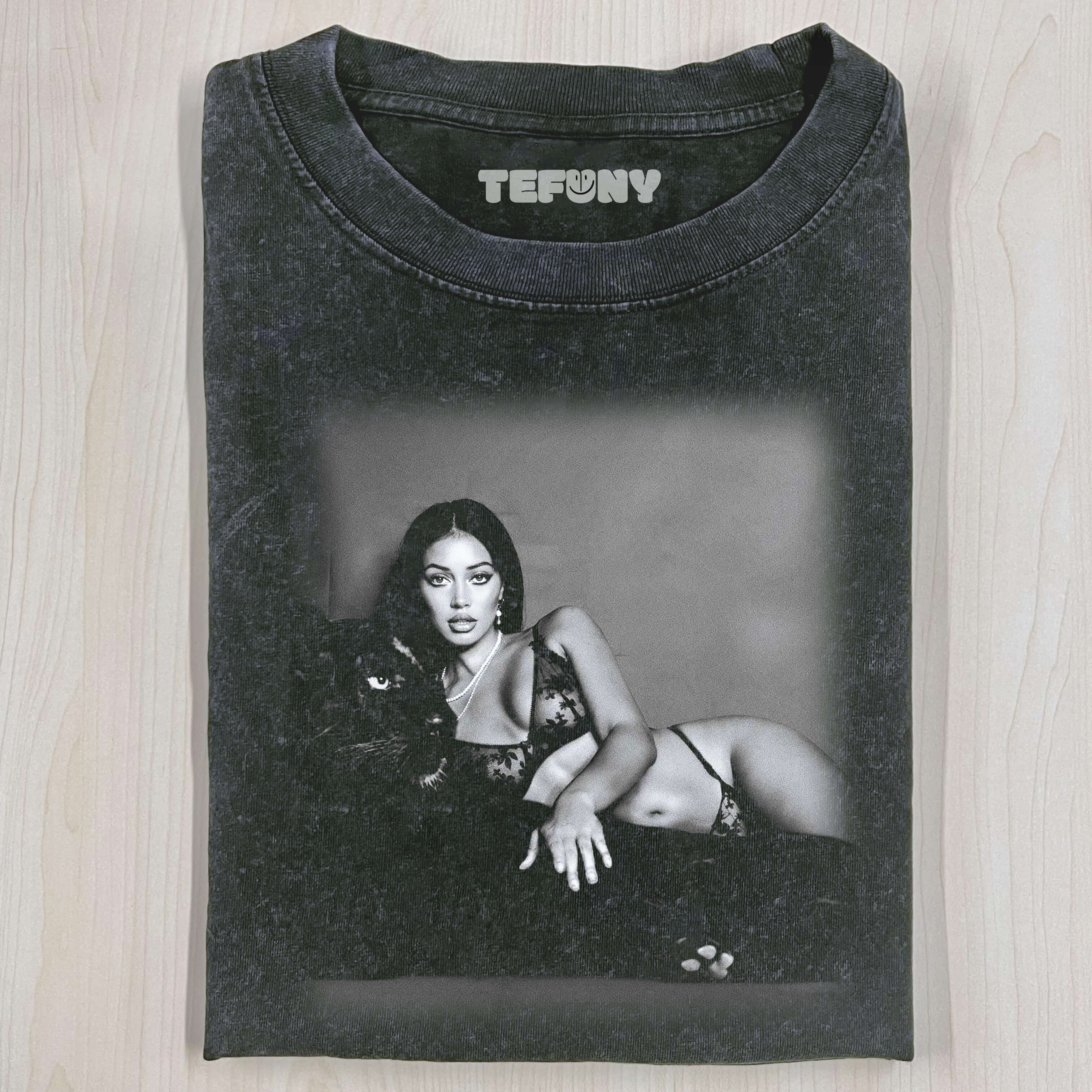 CINDY KIMBERLY HOLDING A LEOPARD T-SHIRT