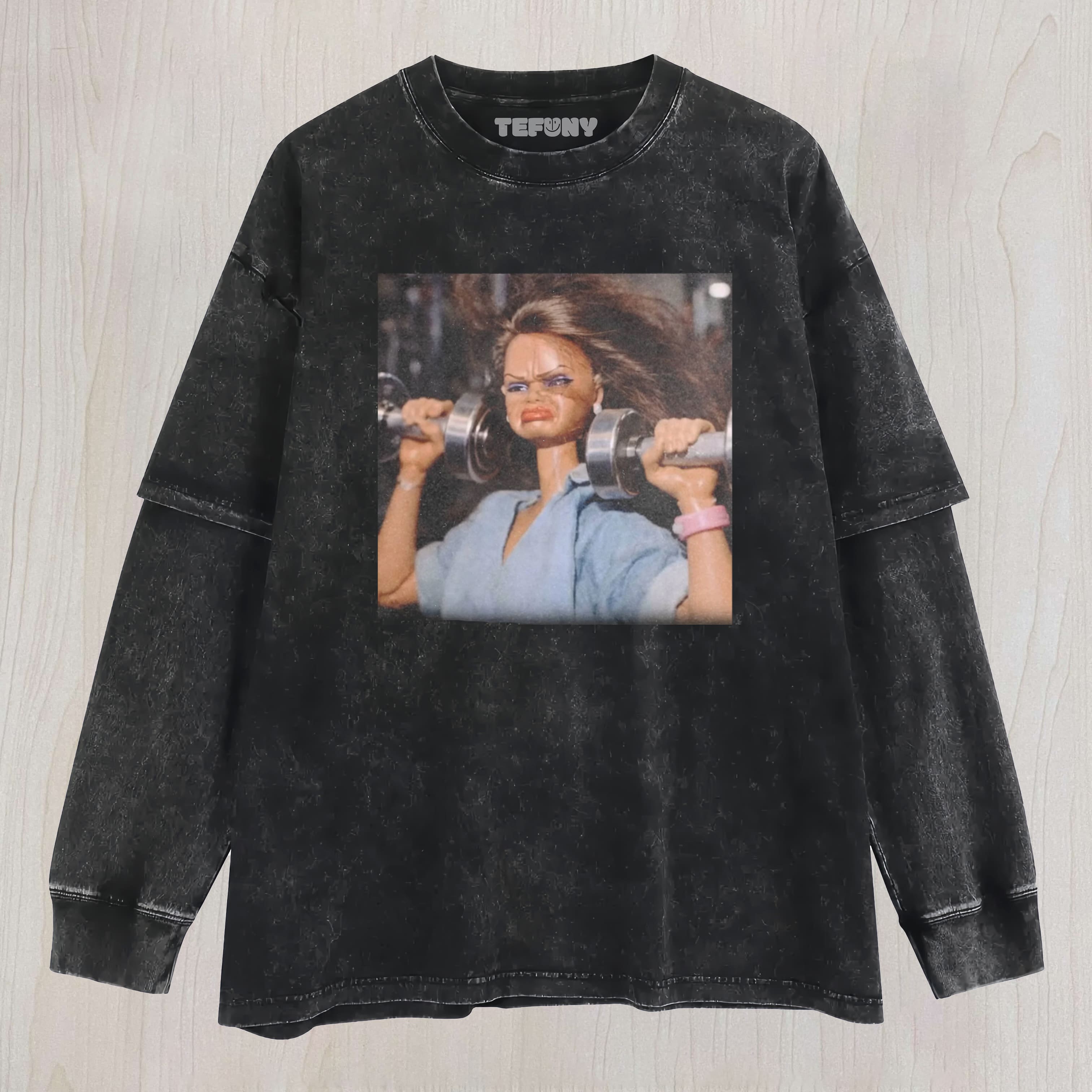 DOLL FACE MEME SHE'S BUILT DIFFERENT UNISEX TEE, TANK TOP, LAYERED LS, SWEATSHIRT & HOODIE