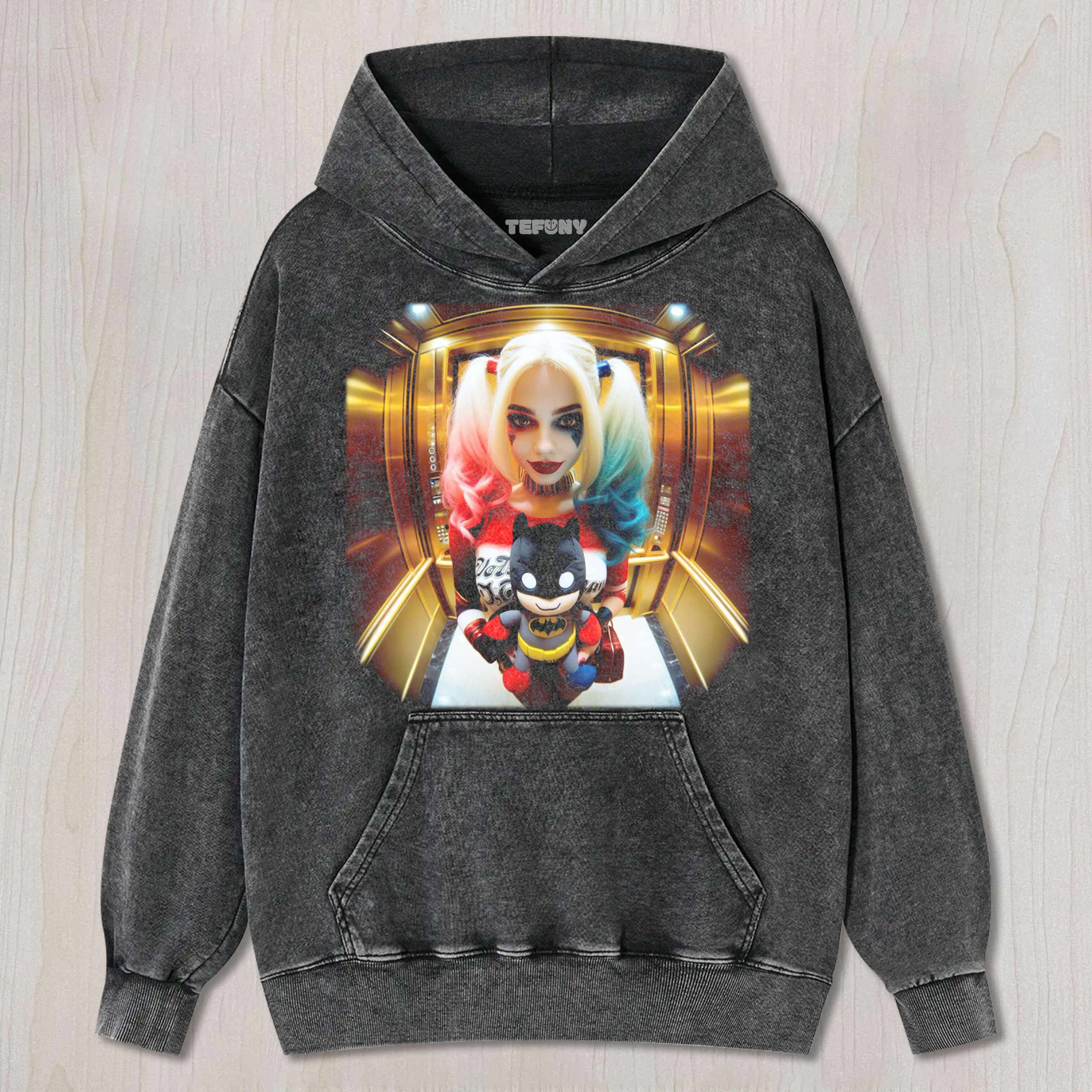 HARLEY QUINN HOLDING A BATMAN DOLL TEE & SWEAT & HOOD
