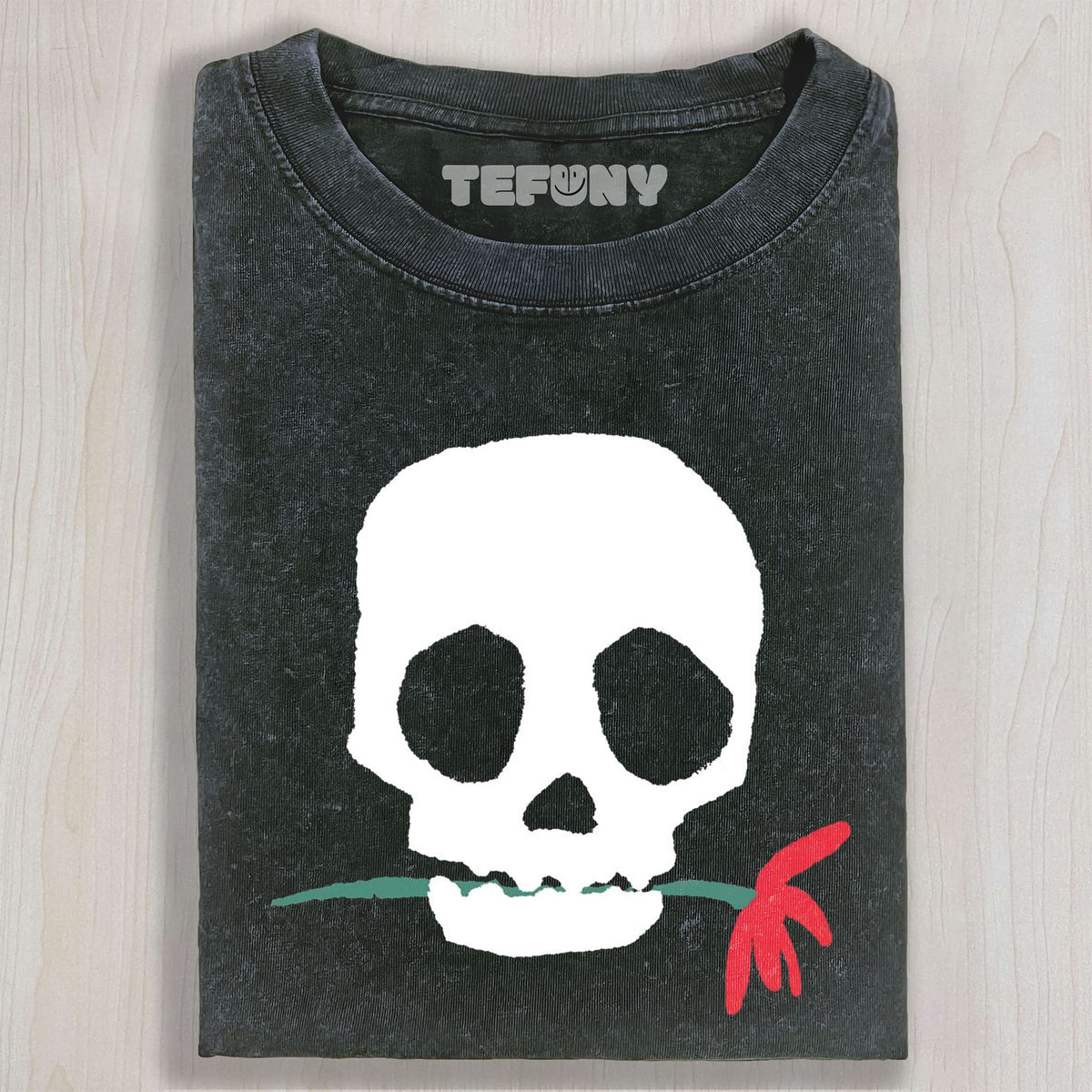 THE SKULL BITING A FLOWER UNISEX TEE, TANK TOP, LAYERED LS, SWEATSHIRT & HOODIE