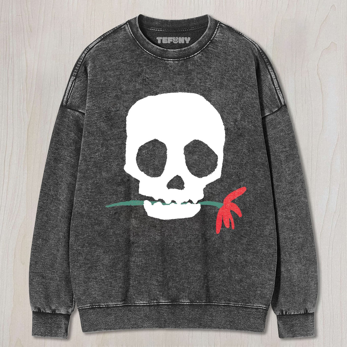 THE SKULL BITING A FLOWER UNISEX TEE, TANK TOP, LAYERED LS, SWEATSHIRT & HOODIE