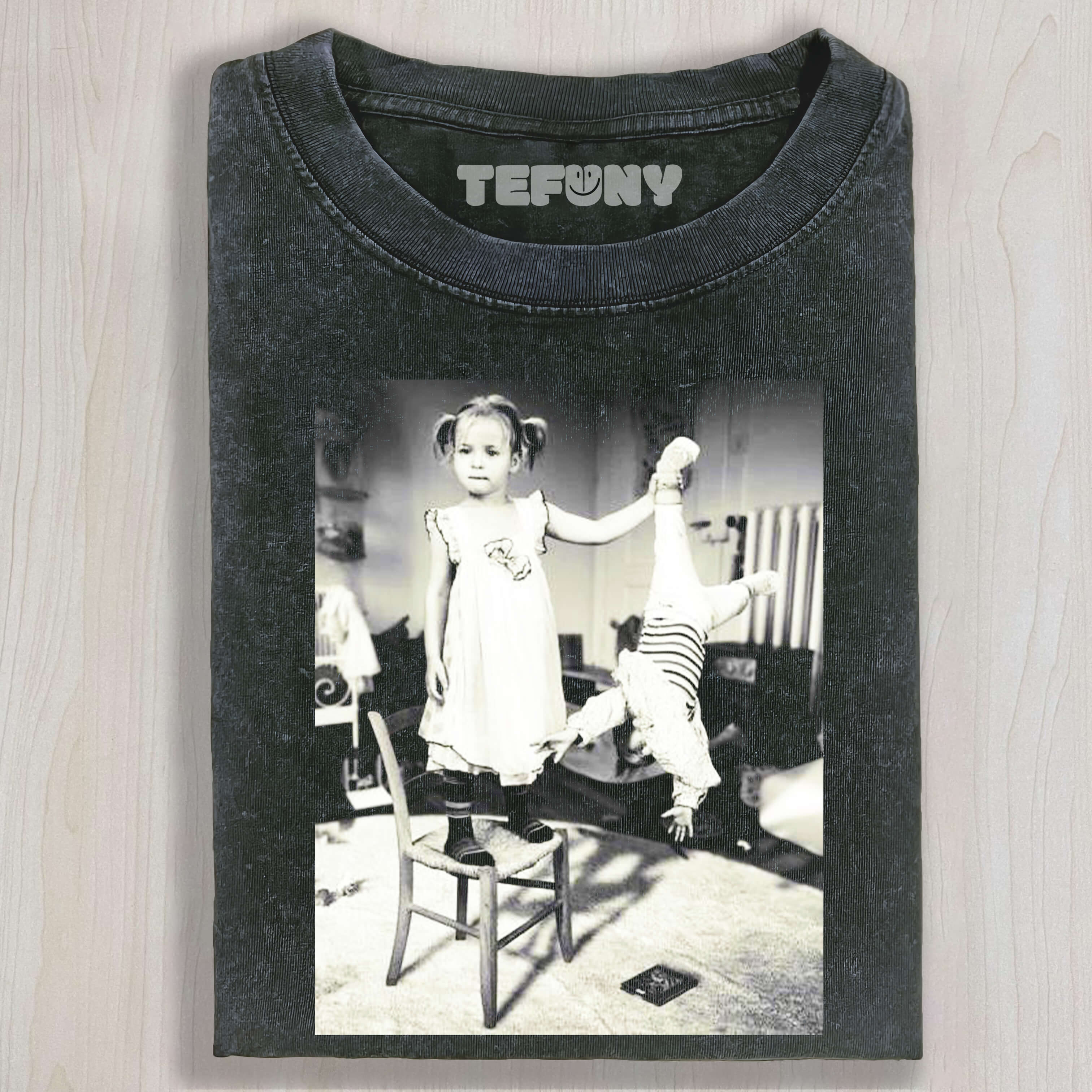 THE CHILD WAS HOLDING ONTO ANOTHER CHILD'S FOOT T-SHIRT & LONG SLEEVES & HOODIES