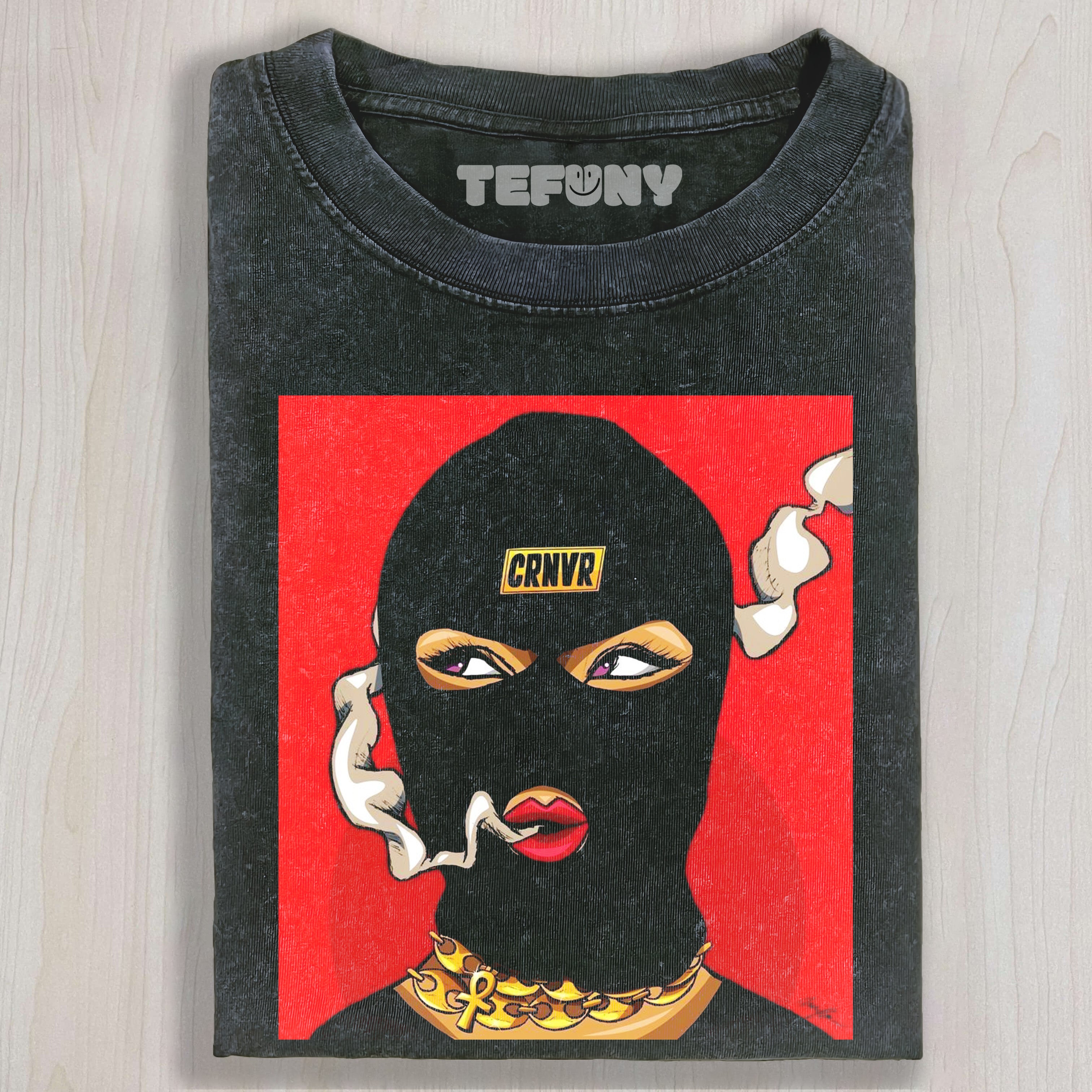 A PERSON SMOKING WHILE WEARING A HAT T-SHIRT & LONG SLEEVES & HOODIES