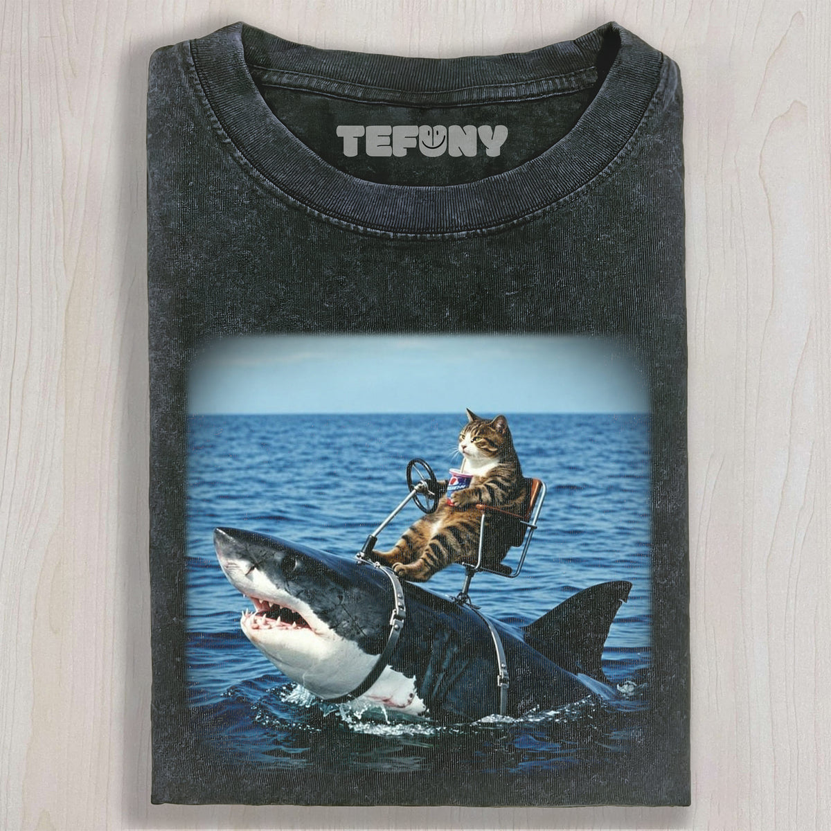 CAT RIDING A SHARK UNISEX TEE, TANK TOP, LAYERED LS, SWEATSHIRT & HOODIE