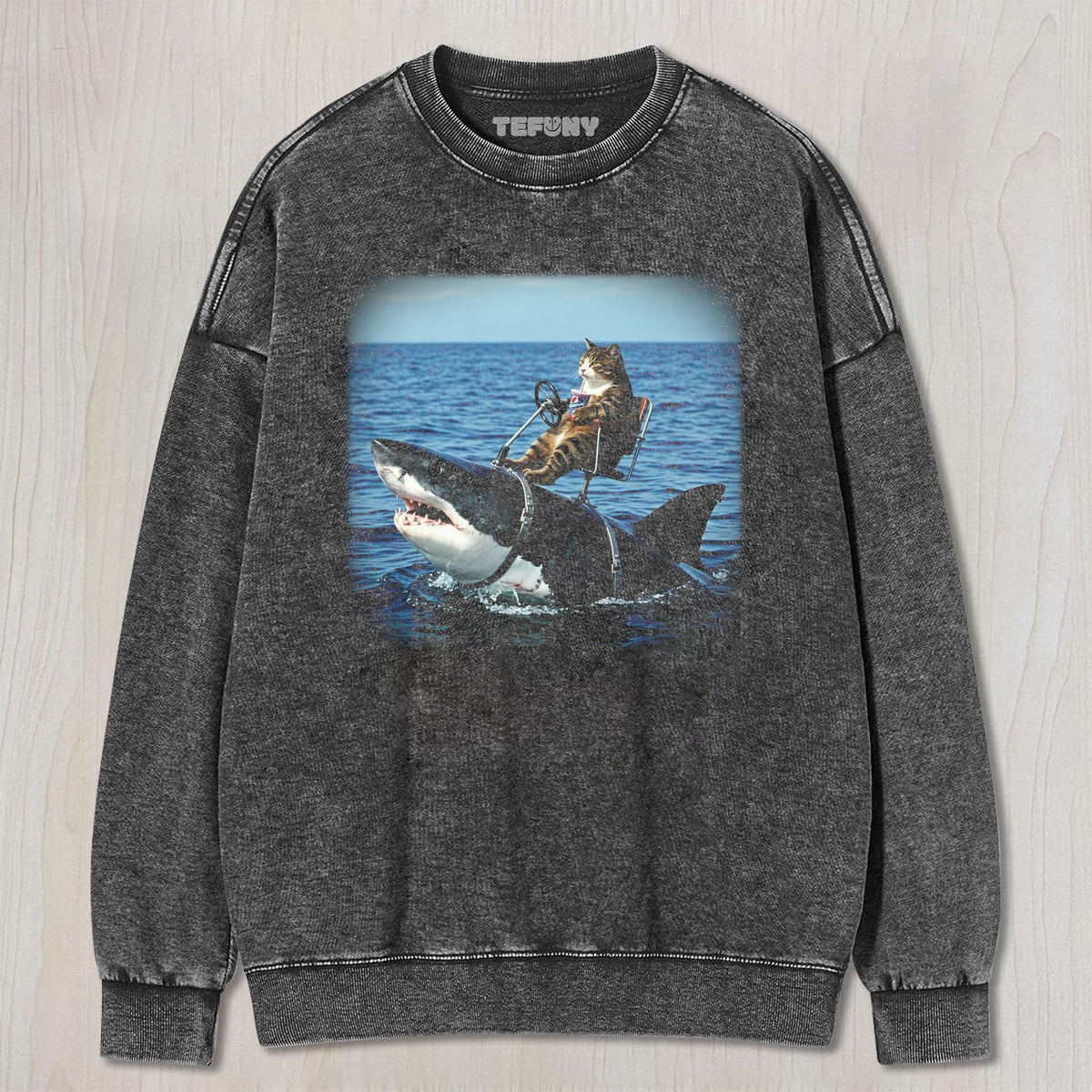 CAT RIDING A SHARK UNISEX TEE, TANK TOP, LAYERED LS, SWEATSHIRT & HOODIE