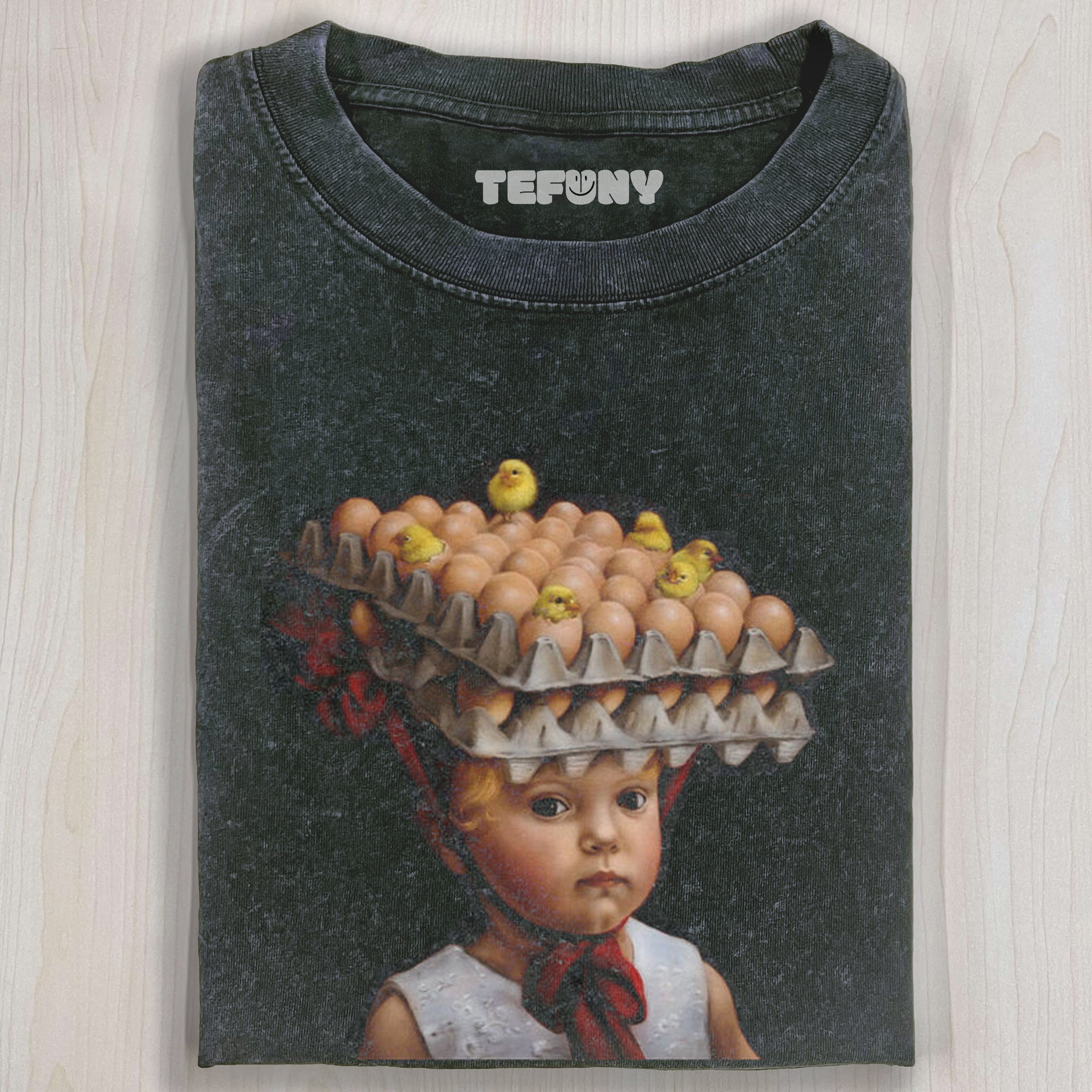 CHILD WITH EGG CARTONS AND CHICKS ON HEAD TEE
