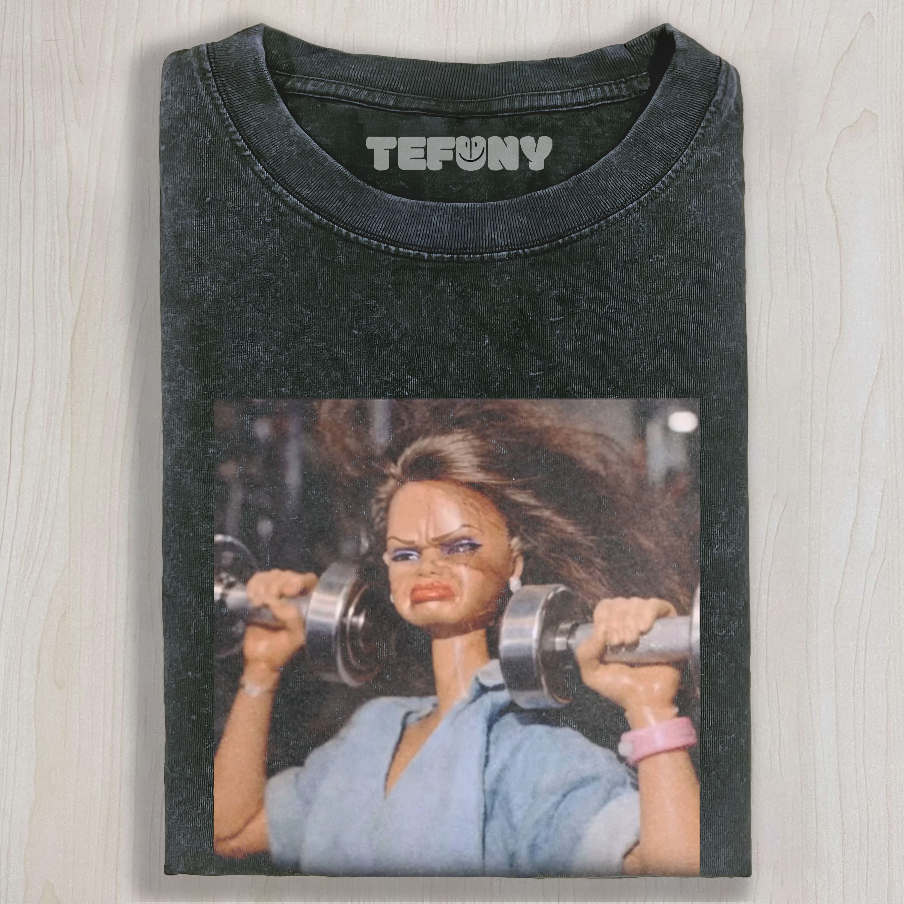 DOLL FACE MEME SHE'S BUILT DIFFERENT UNISEX TEE, TANK TOP, LAYERED LS, SWEATSHIRT & HOODIE