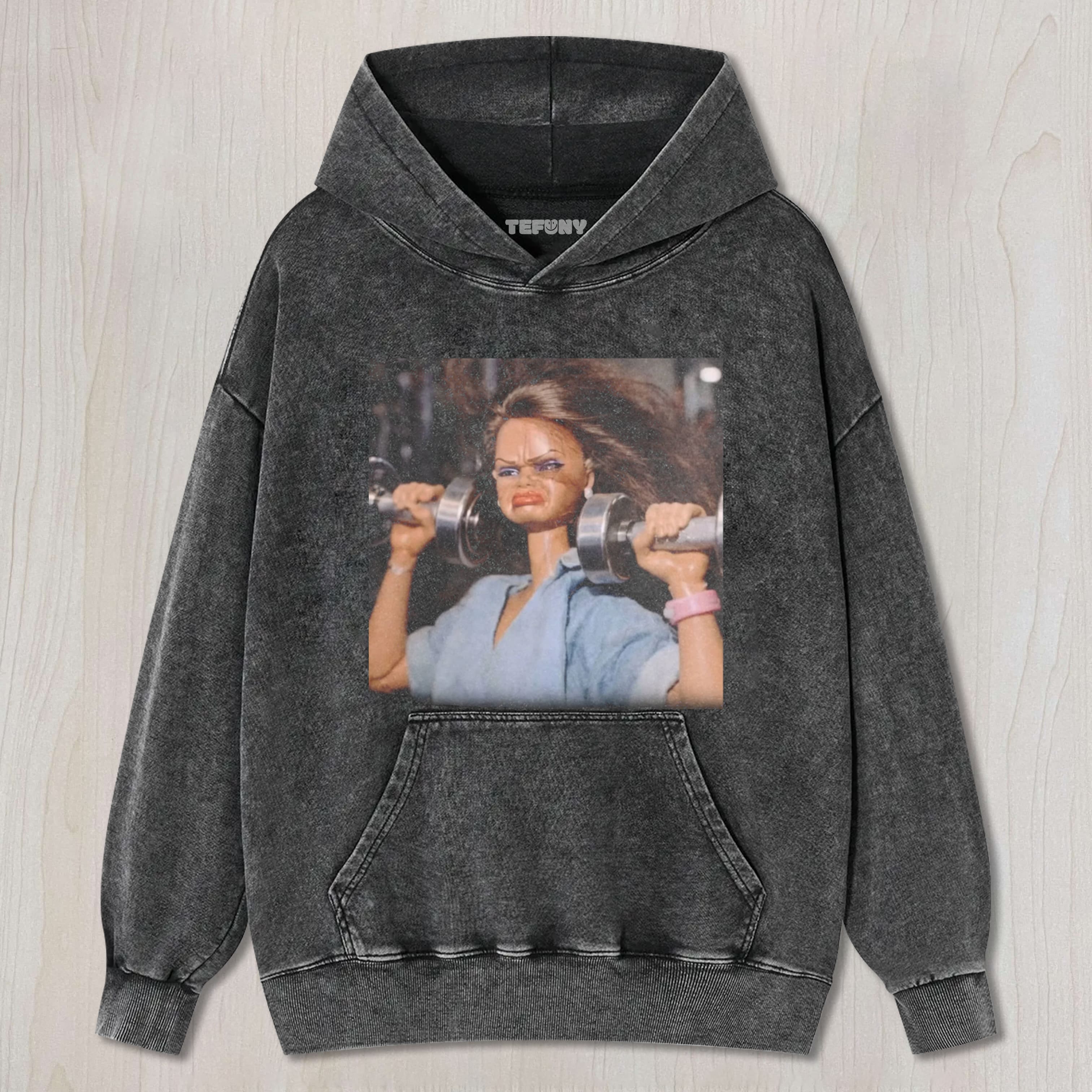 DOLL FACE MEME SHE'S BUILT DIFFERENT UNISEX TEE, TANK TOP, LAYERED LS, SWEATSHIRT & HOODIE