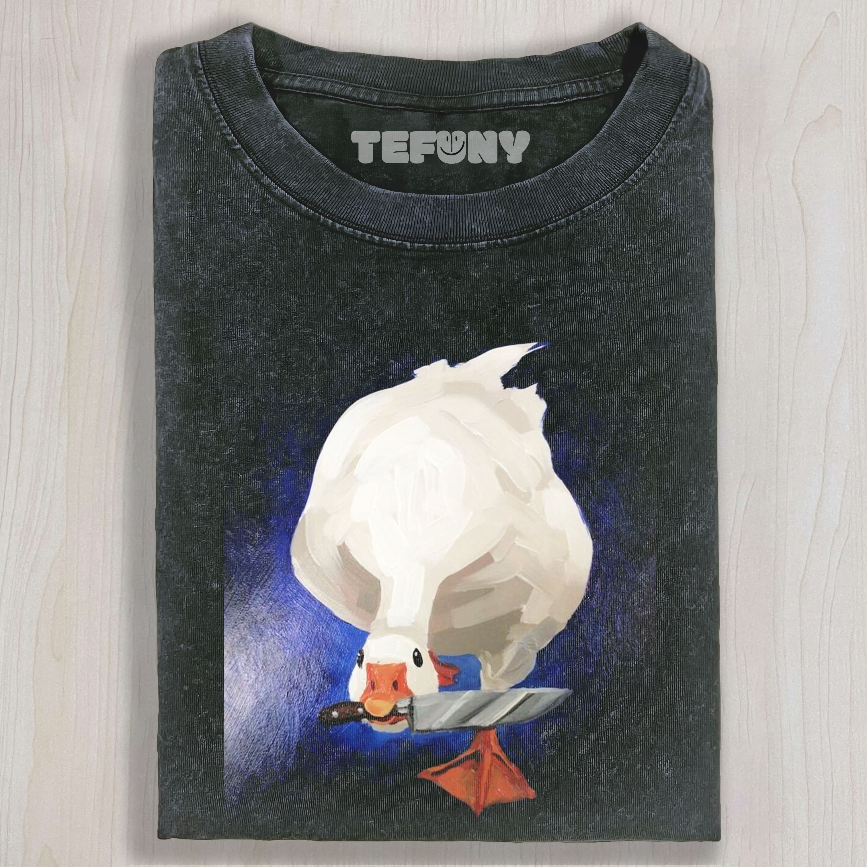 GOOSE HOLDING A KNIFE UNISEX TEE, TANK TOP, LAYERED LS, SWEATSHIRT & HOODIE