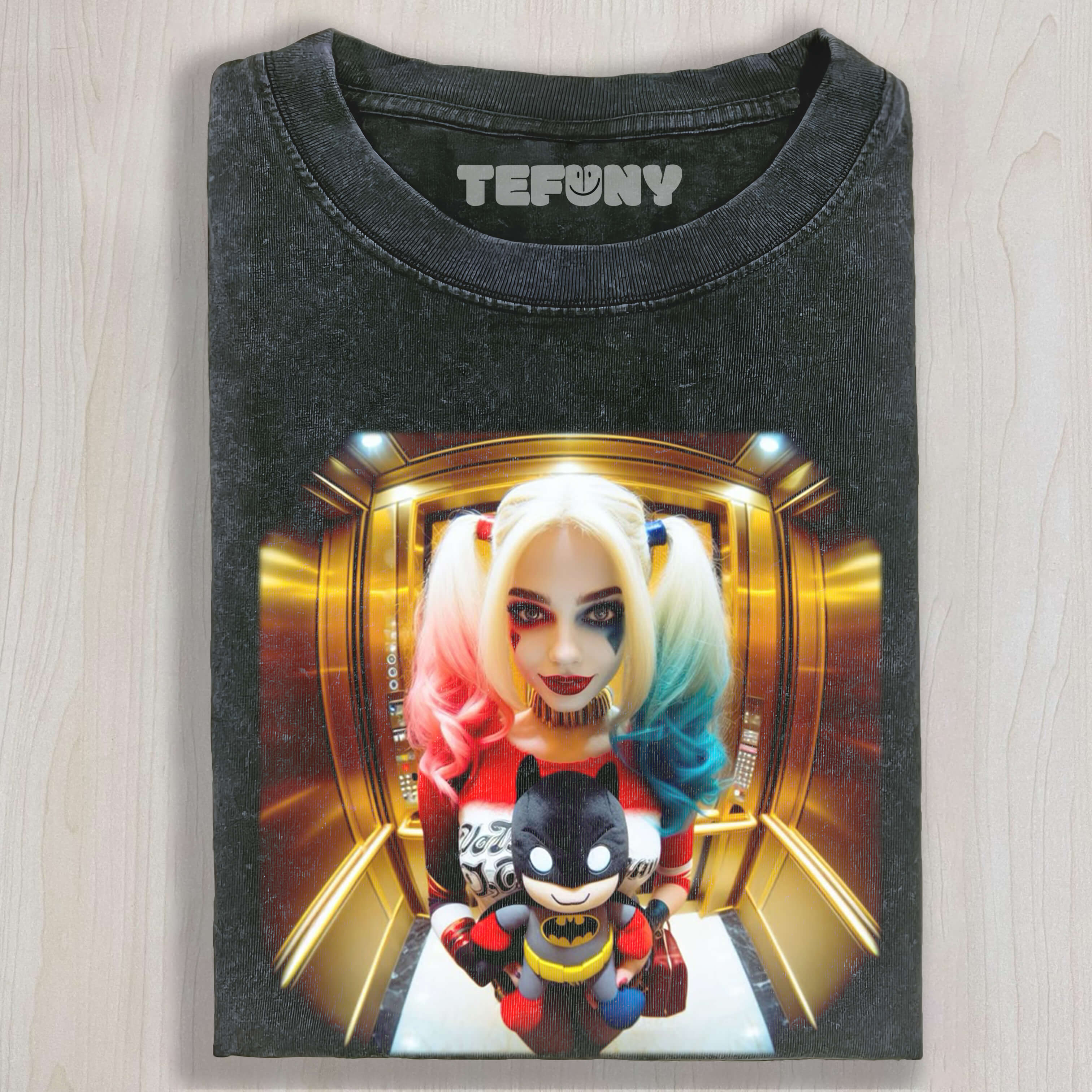 HARLEY QUINN HOLDING A BATMAN DOLL TEE & SWEAT & HOOD