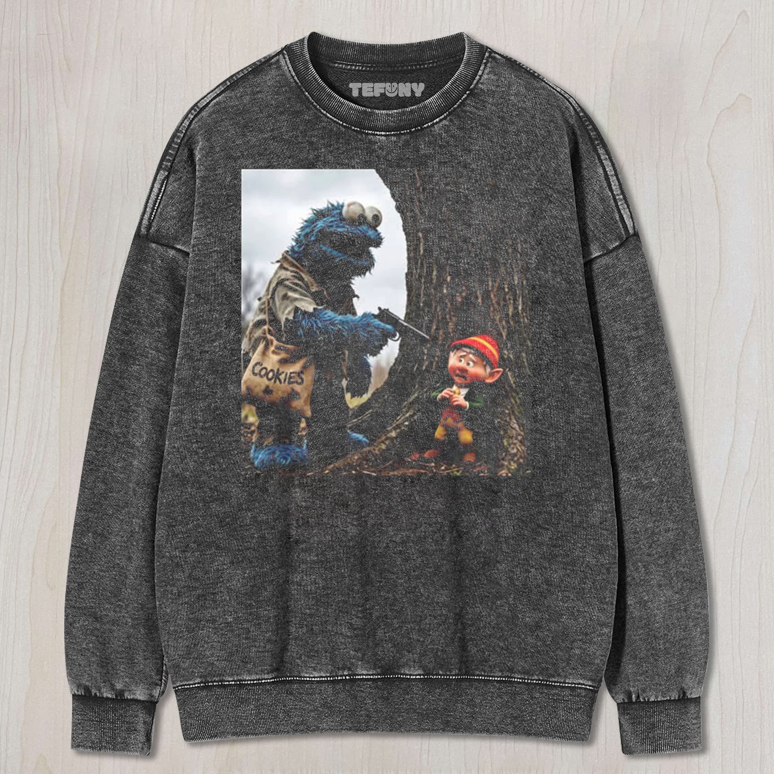THE COOKIE MONSTER POINTS A GUN AT THE ELF UNISEX TEE, TANK TOP, LAYERED LS, SWEATSHIRT & HOODIE