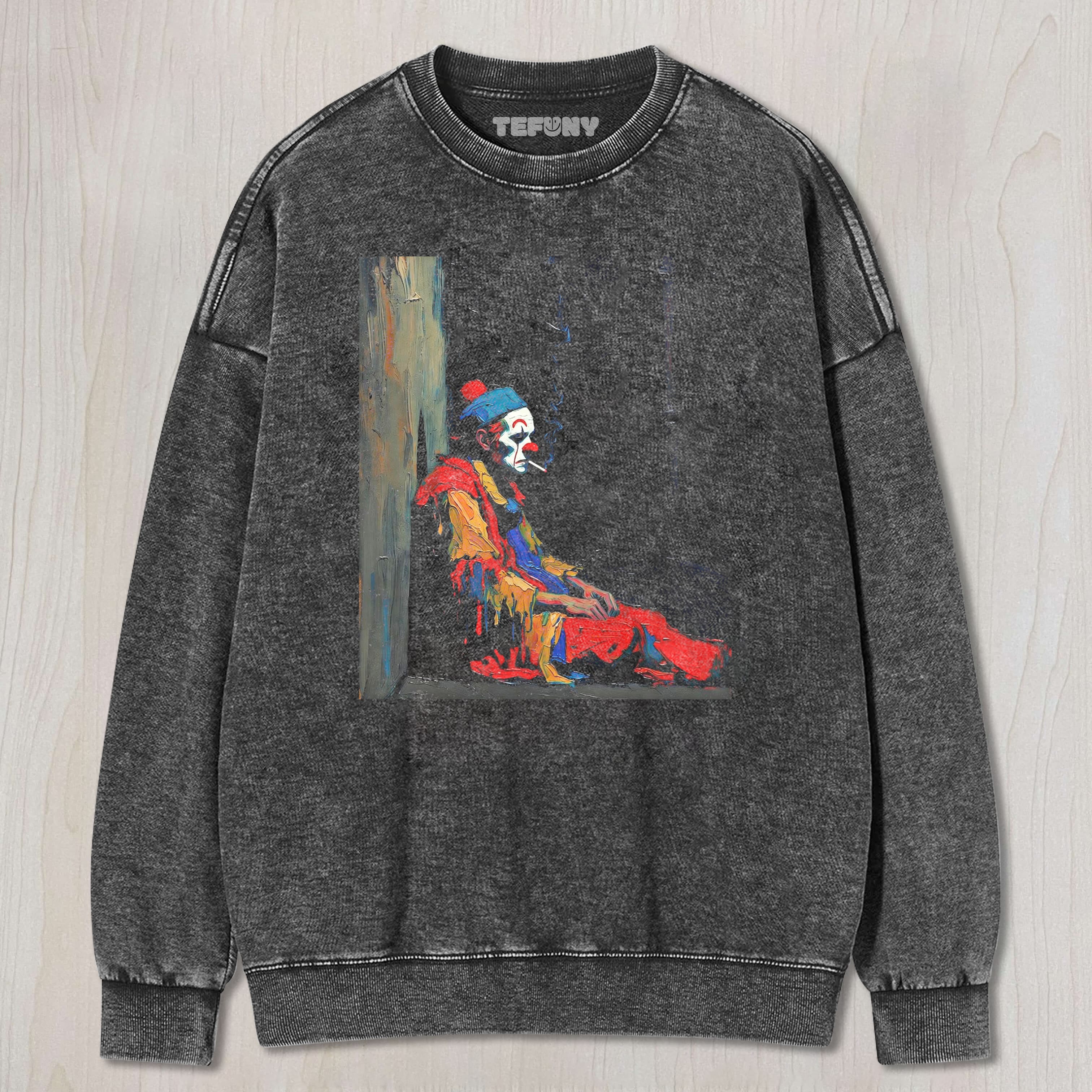 THE MELANCHOLY CLOWN IS SMOKING UNISEX TEE, TANK TOP, LAYERED LS, SWEATSHIRT & HOODIE