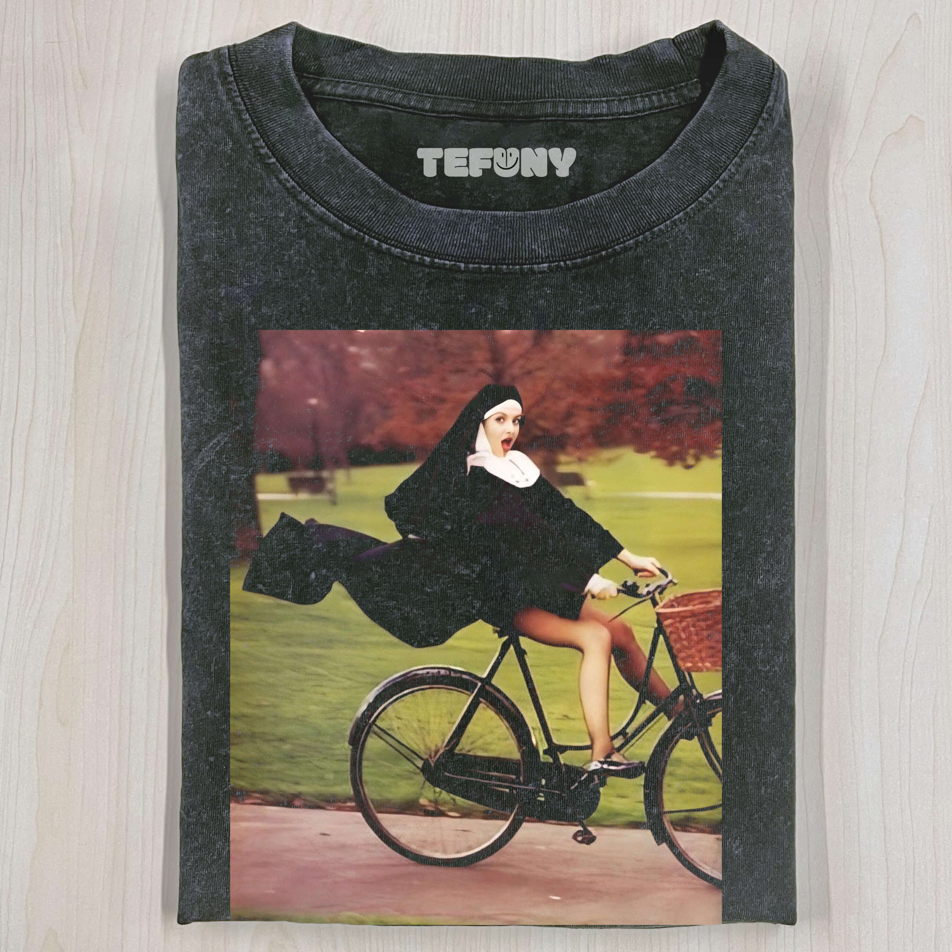 THE NUN IS RIDING A BICYCLE T-SHIRT