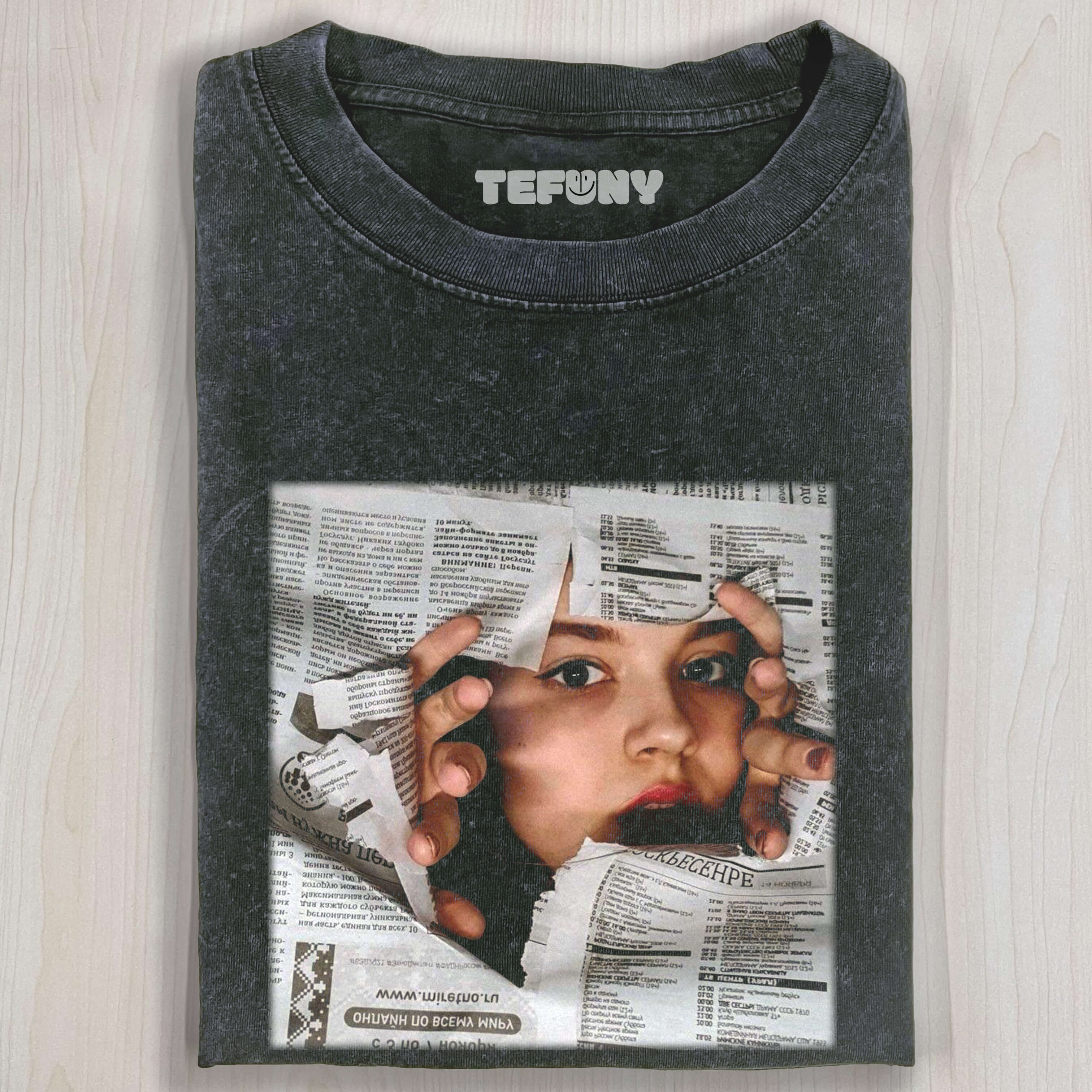 WOMAN EMERGING FROM NEWSPAPER T-SHIRT